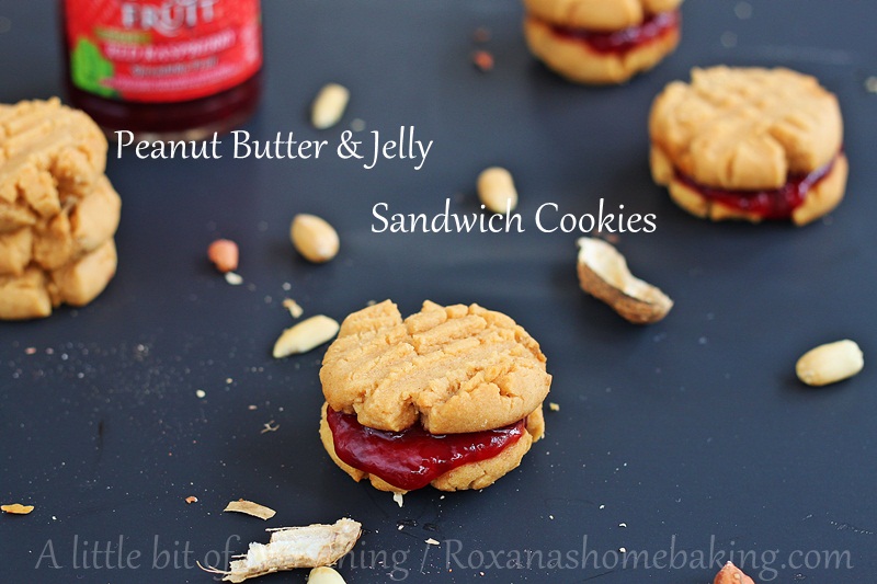 Soft melt-in-your-mouth Peanut Butter cookies sandwiched with berry jelly - Classic peanut butter jelly just got a make-over. Recipe from Roxanashomebaking.com