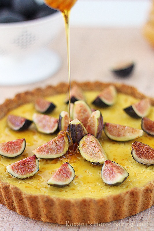 A creamy, sweet ricotta tart brushed with honey and decorated with fragrant fresh figs. Recipe from roxanashomebaking.com