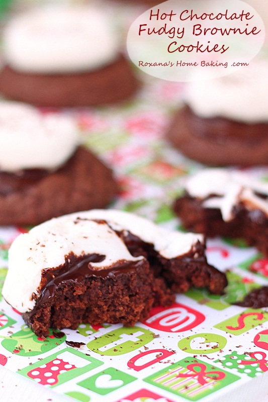 Hot chocolate fudgy brownie cookies topped with oozing chocolate and a gooey marshmallow. A delicious way to impress your loved ones. Recipe from Roxanashomebaking.com