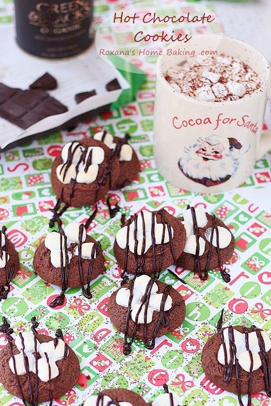 Hot chocolate fudgy brownie cookies topped with oozing chocolate and a gooey marshmallow. A delicious way to impress your loved ones. Recipe from Roxanashomebaking.com