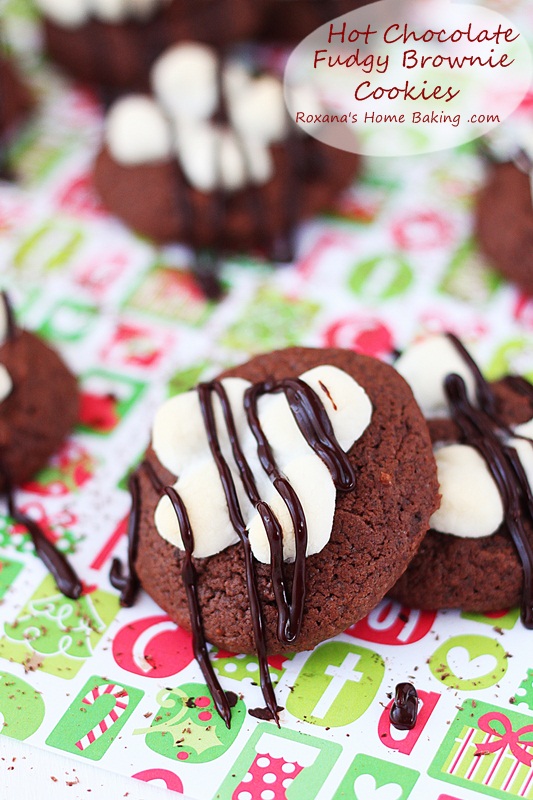 Hot chocolate fudgy brownie cookies topped with oozing chocolate and a gooey marshmallow. A delicious way to impress your loved ones. Recipe from Roxanashomebaking.com