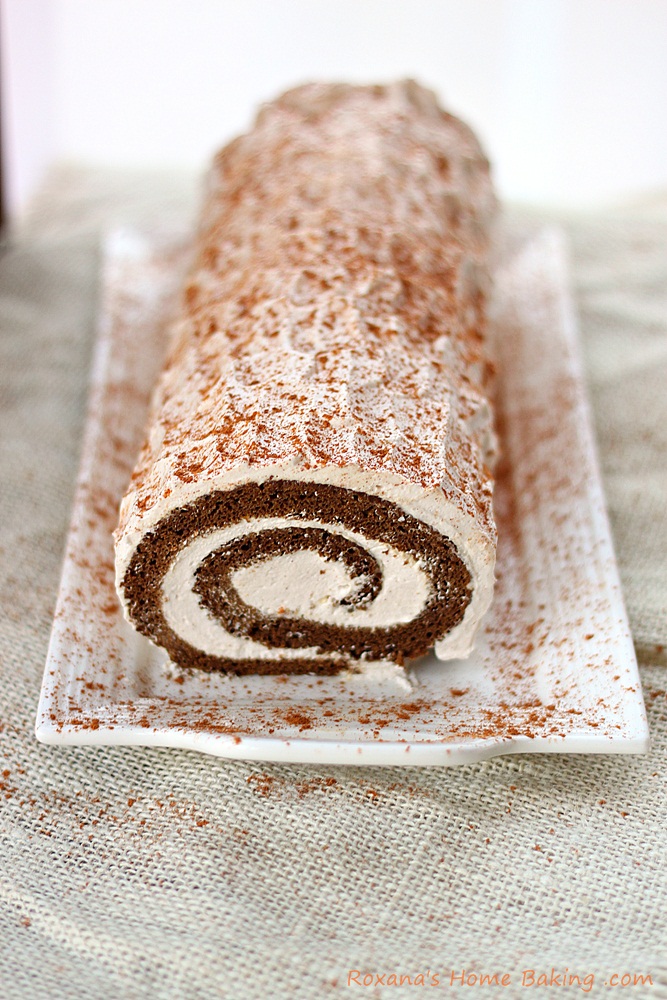 Moist gingerbread roll cake filled with spiced creamy filling from Roxanashomebaking.com 