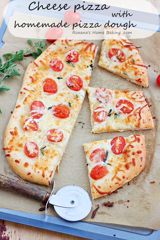 Made-from-scratch flavorful cheese pizza dough topped with more cheese and half graped tomatoes. Friday night pizza just got a whole lot better! Recipe from Roxanashomebaking.com