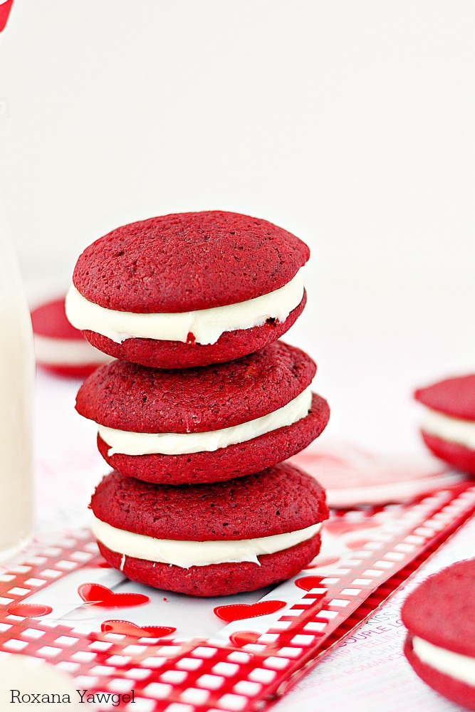 Red velvet whoopie pies with cream cheese frosting - Soft, cake-like red velvet cookies sandwiched with a smooth sweet cream cheese frosting