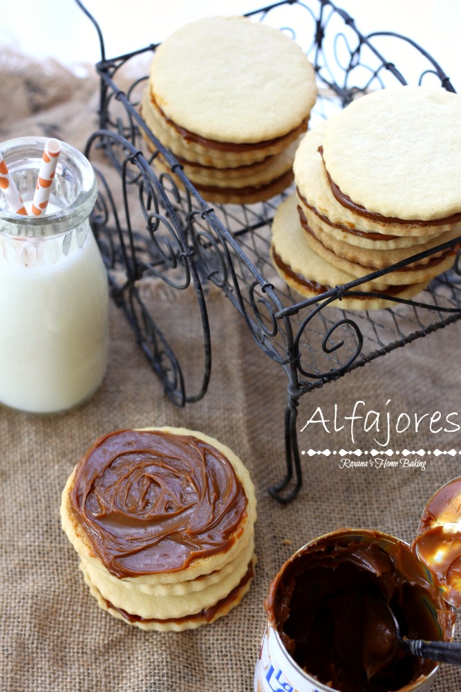 Alfajores, also known as dulce de leche sandwich cookies, are traditional shortbread cookies with a dulce de leche filling. Recipe from Roxanashomebaking.com