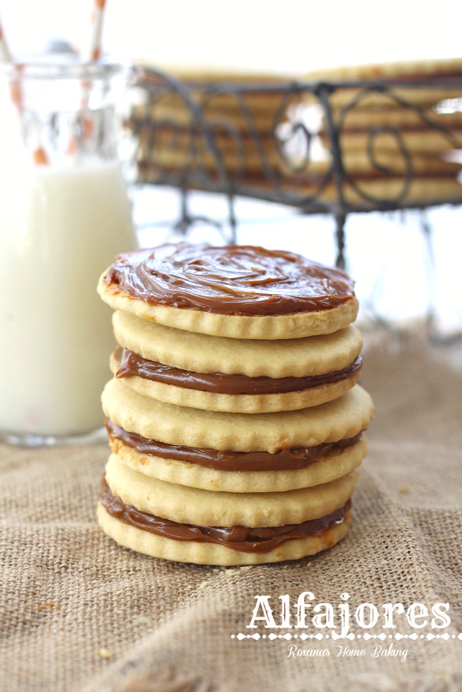 Alfajores, also known as dulce de leche sandwich cookies, are traditional shortbread cookies with a dulce de leche filling. Recipe from Roxanashomebaking.com