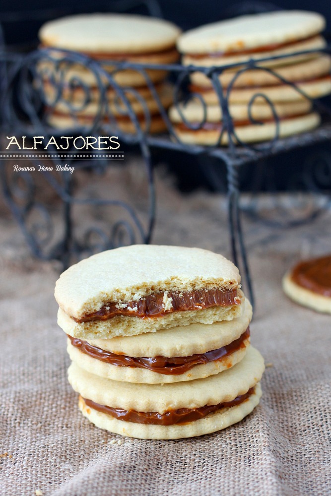Alfajores, also known as dulce de leche sandwich cookies, are traditional shortbread cookies with a dulce de leche filling. Recipe from Roxanashomebaking.com