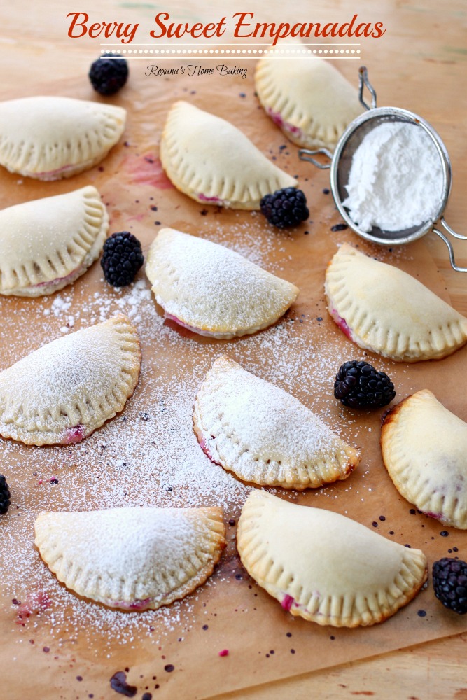 Flaky pastry pockets filled with creamy ricotta and a juicy blackberry from Roxanashomebaking.com A sweet twist on traditional empanadas.  