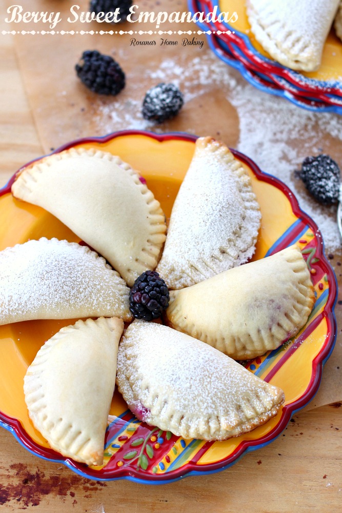 Flaky pastry pockets filled with creamy ricotta and a juicy blackberry from Roxanashomebaking.com A sweet twist on traditional empanadas.  