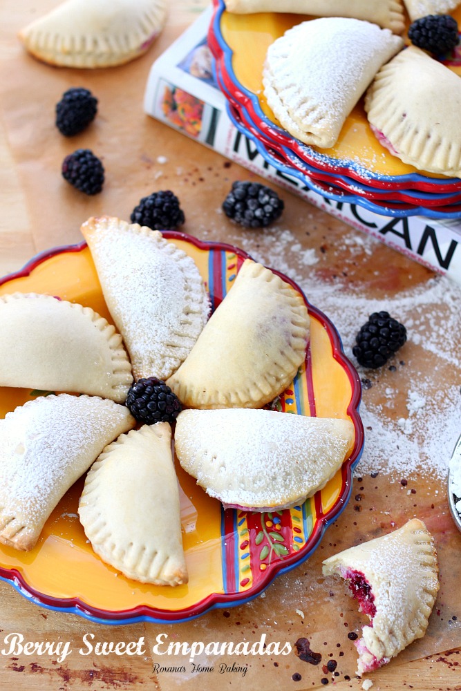 Flaky pastry pockets filled with creamy ricotta and a juicy blackberry from Roxanashomebaking.com A sweet twist on traditional empanadas.  