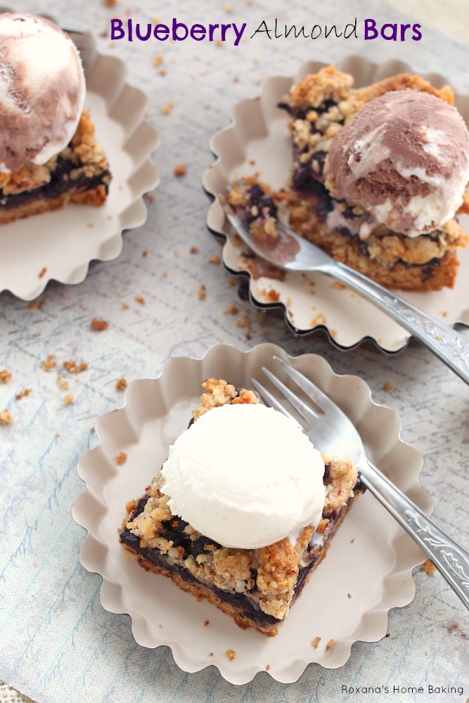 Blueberry almond bars from Roxanashomebaking.com  Buttery cookie almond base topped with a layer of sweet and juicy blueberries and crumbled topping. A great way to enjoy both fruit and nuts in one bite.