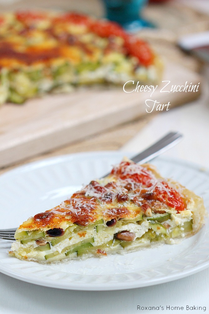 Cheesy zucchini tart - a crowd pleaser may it be at your next picnic, potluck or just family dinner. Recipe from Roxanashomebaking.com