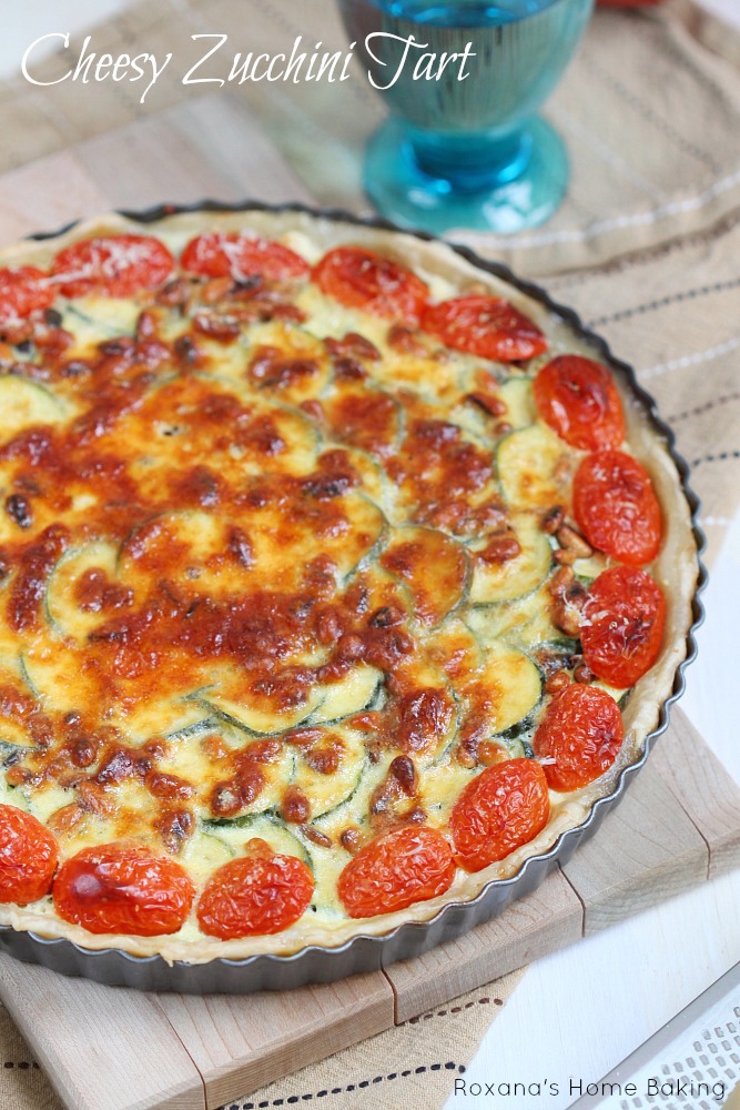 Cheesy zucchini tart with pine nuts and grape tomatoes