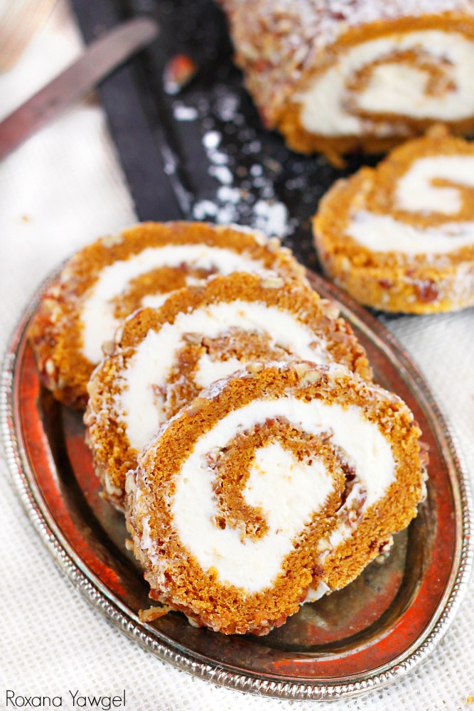 A classic fall dessert, pecan pumpkin roll cake with smooth cream cheese filling is a must at our Thanksgiving table. One bite and you'll understand why!