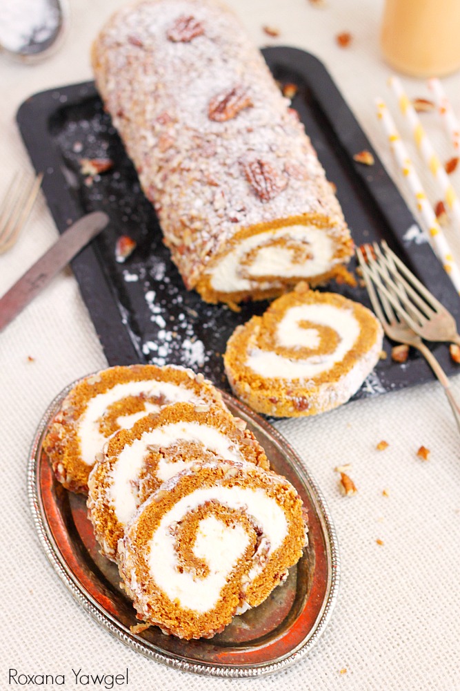 A classic fall dessert, pecan pumpkin roll cake with smooth cream cheese filling is a must at our Thanksgiving table. One bite and you'll understand why!