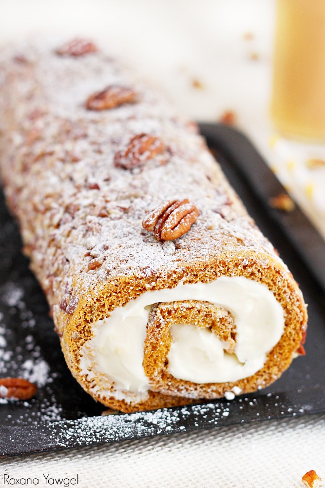 A classic fall dessert, pecan pumpkin roll cake with smooth cream cheese filling is a must at our Thanksgiving table. One bite and you'll understand why!