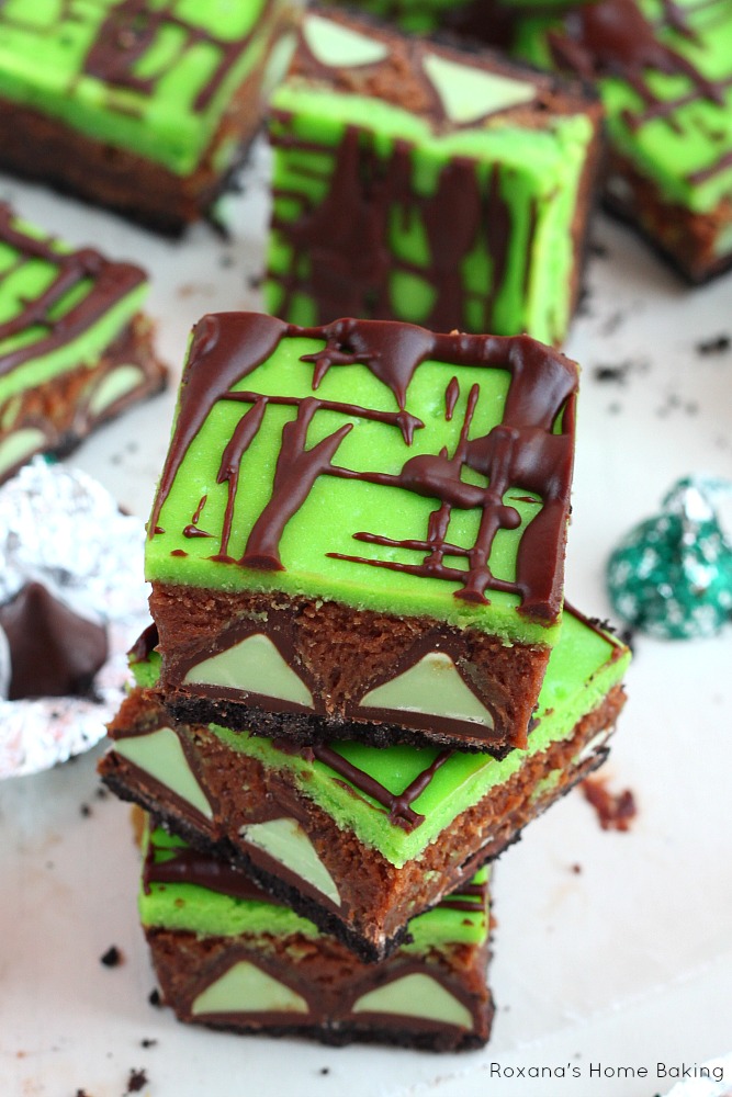 Over the top fudge brownies packed with mint truffles and a layer of creamy cheesecake, these brownie cheesecake bars are better than any mint patties you ever had!