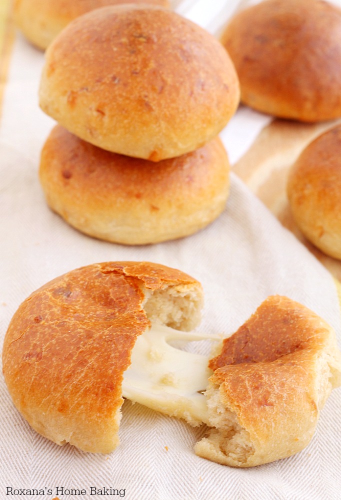 Soft homemade cheese dinner rolls made with three types of cheese and filled with an ooye-gooey cheese cube. Dinner just got cheesier! 