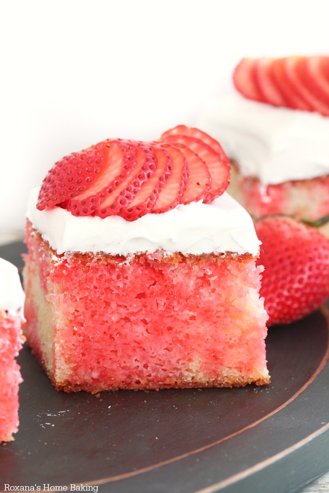 With its pretty red stripes, this made-from-scratch poke cake drenched in strawberry flavored syrup and topped with whipped topping will be a hit with everyone.