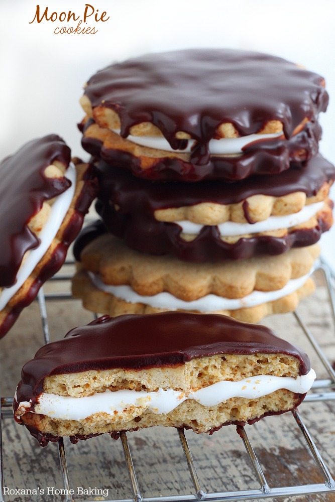 Melt in your mouth graham cookies filled with homemade marshmallow creme and dipped in chocolate ganache - these moon pie cookies are what dreams are made of.