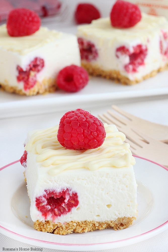 White chocolate meets fresh raspberries in these luscious cheesecake bars. So incredible creamy and so easy to make (the filling requires no baking!) they will be a favorite year round!