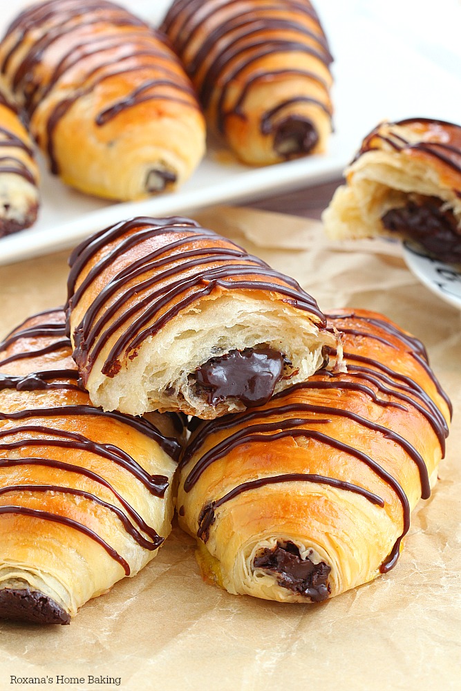 Layer upon layer of light, buttery flaky pastry filled with rich chocolate and drizzled with more chocolate, these made from scratch chocolate croissants are simply mind-blowing! No butter folding or chilling the dough several times needed! 