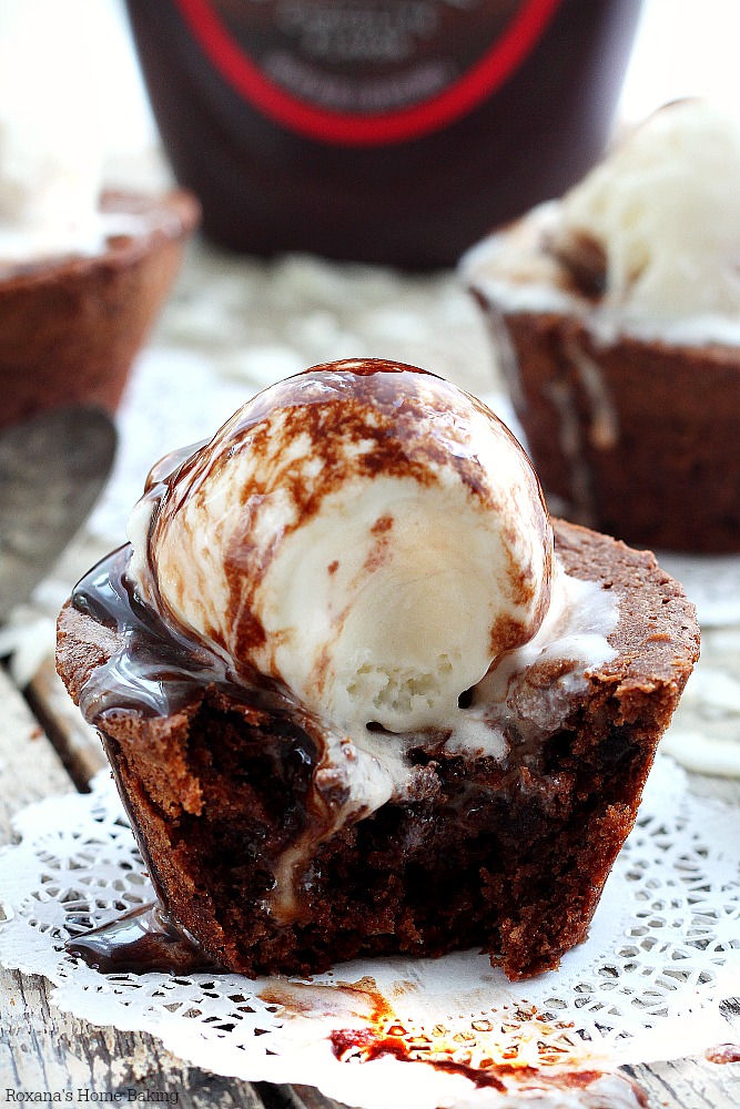 Easy to make cocoa brownies packed with flaked coconut and chopped chocolate. Rich, dense and chewy, these coconut brownies are topped with coconut ice-cream and chocolate syrup for the ultimate brownie sundae! 