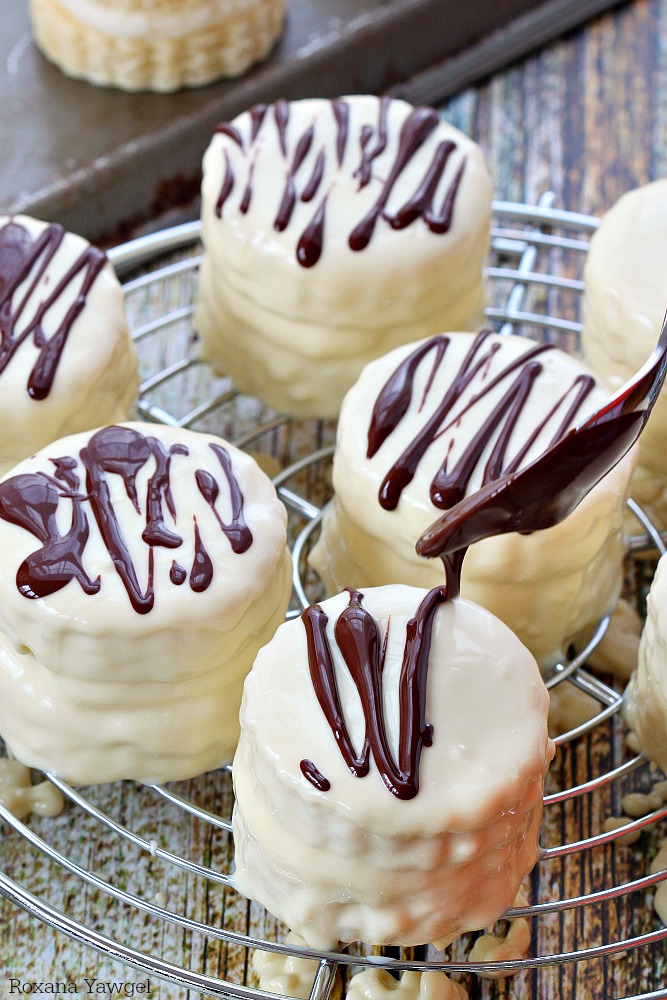 Infused with vanilla flavor and coated in white chocolate with dark chocolate stripes, these made from scratch copycat zebra cakes are dangerously good! 