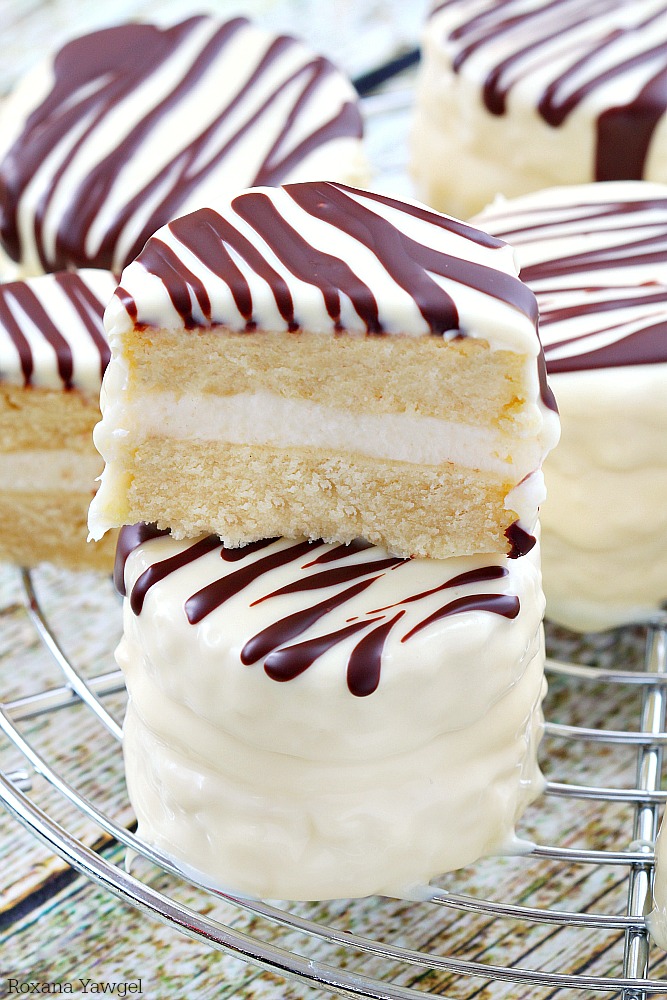 Infused with vanilla flavor and coated in white chocolate with dark chocolate stripes, these made from scratch copycat zebra cakes are dangerously good! 