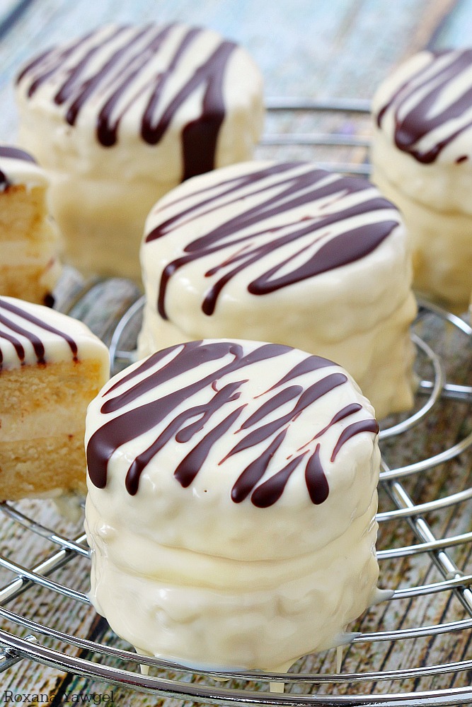 Infused with vanilla flavor and coated in white chocolate with dark chocolate stripes, these made from scratch copycat zebra cakes are dangerously good! 