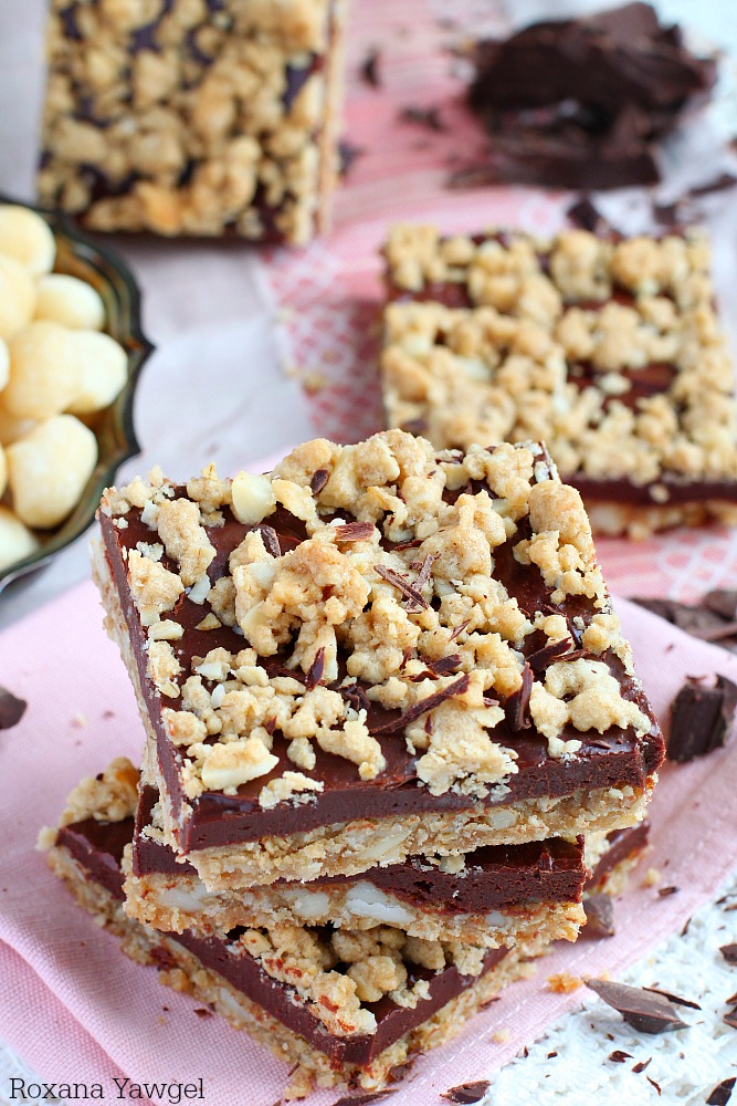 Chewy oatmeal cookie crust packed with buttery macadamia nuts and topped with a rich fudge layer...these macadamia fudge bars are sooo irresistible!