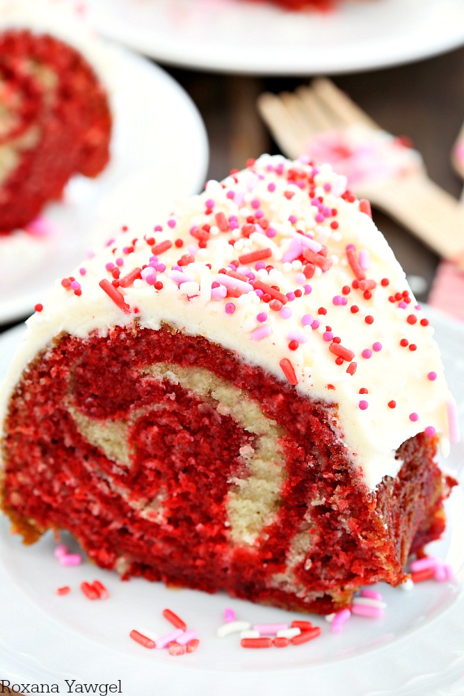 With the right amount of buttermilk and vanilla extract, and cocoa powder added to the red swirl, this made from scratch white and red velvet cake will make everyone's heart sing! 