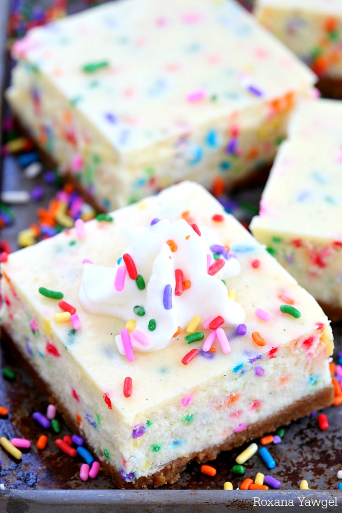 Silky and dreamy funfetti vanilla bean cheesecake bars bursting with a wonderful, crave-worthy vanilla flavor and packed with colorful sprinkles in every bite!
