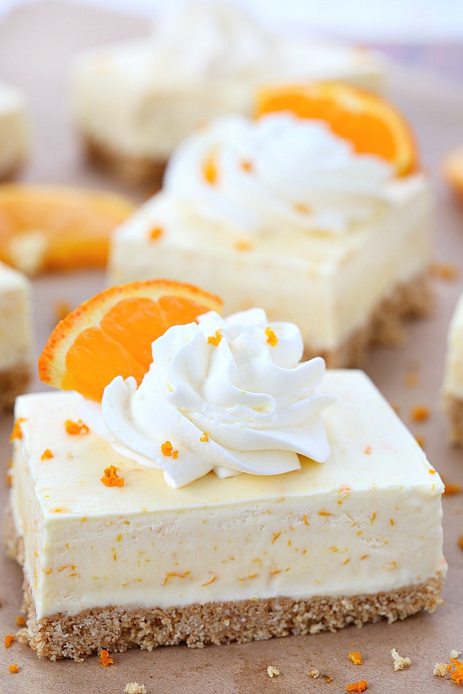 Summer in a bite, these orange dreamsicle pie bars are packed with orange flavor from freshly squeezed orange juice and grated orange rind! Forget the orange flavored jello, these orange dreamsicle pie bars taste so much better!