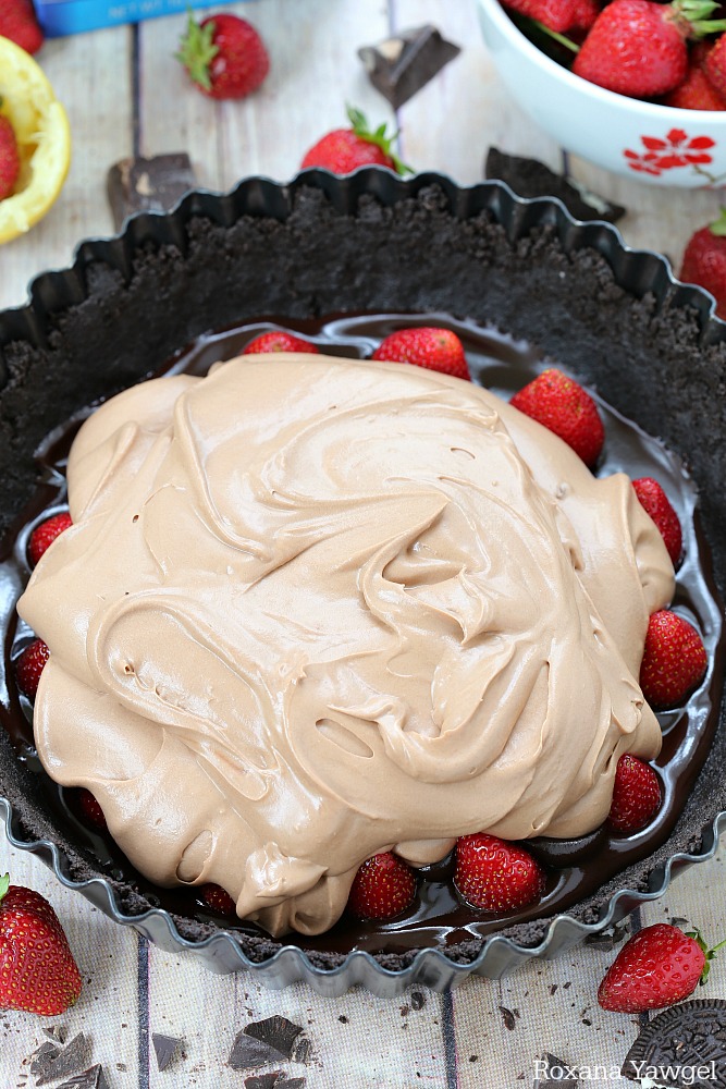 Chocolate crust, fresh strawberries, and a dreamy silky chocolate filling turn this easy and decadent no-bake strawberry chocolate pie into a showstopping dessert.