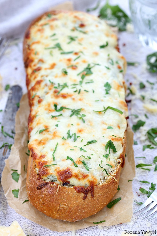 Three types of cheese and a dollop of yogurt make this spinach artichoke dip stuffed bread incredibly creamy and cheesy. It is a guaranteed hit with the crowd and always disappears – no leftovers in sight!
