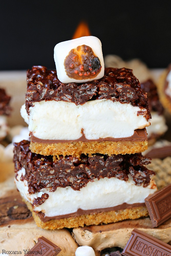 Layers of buttery graham cracker crust, oozing milk chocolate, gooey marshmallows, and chewy chocolate rice krispies, these smores bars will quickly become a summer favorite!