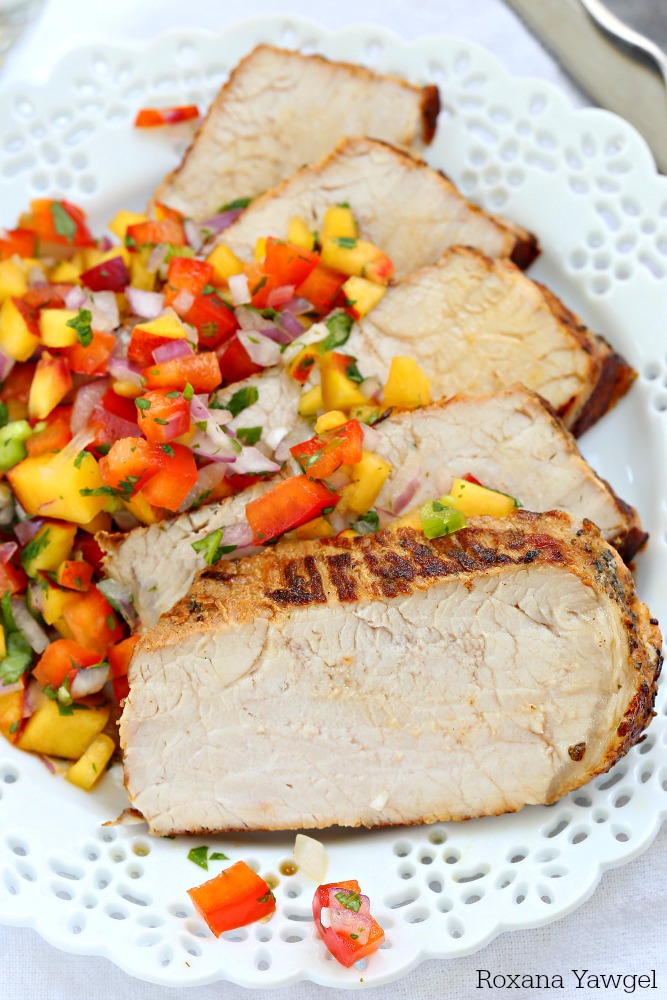 Grilled garlic and herb pork loin with peach salsa is an effortless dinner meal for all those busy weeknights. With only 10 minutes of prep time, you'll be making this over and over again! 