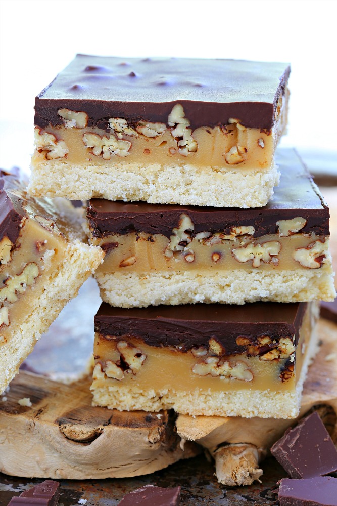 Easy to make butter pecan turtle bars everyone will go crazy over! Buttery cookie, gooey caramel, crunchy pecans and rich ganache - 4 layer of goodness in every bite! 