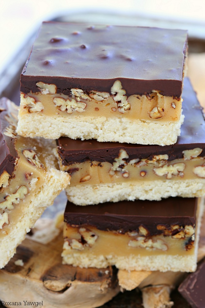 Easy to make butter pecan turtle bars everyone will go crazy over! Buttery cookie, gooey caramel, crunchy pecans and rich ganache - 4 layer of goodness in every bite! 