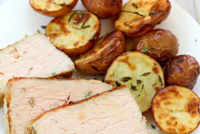 Garlic Herb Pork and Potatoes - an incredibly delicious and super flavorful dinner, cooked all in one pan, making it super easy for cleanup! 5 minutes of prep time and less than 30 minutes into the oven!!