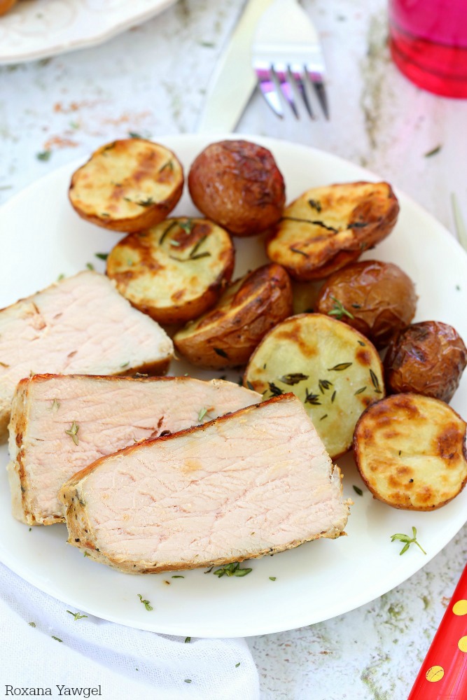 Garlic Herb Pork and Potatoes - an incredibly delicious and super flavorful dinner, cooked all in one pan, making it super easy for cleanup! 5 minutes of prep time and less than 30 minutes into the oven!!