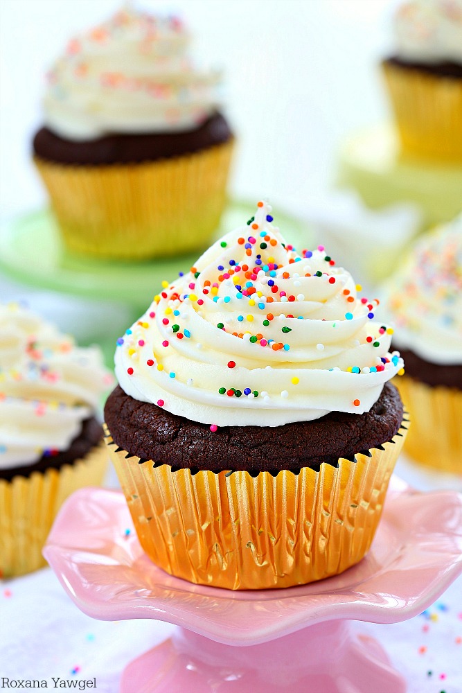 So soft, fluffy, and full of chocolate flavor in every bite, these sugar cookie chocolate cupcakes are piled high with cream cheese frosting and finished with colorful sprinkles! 