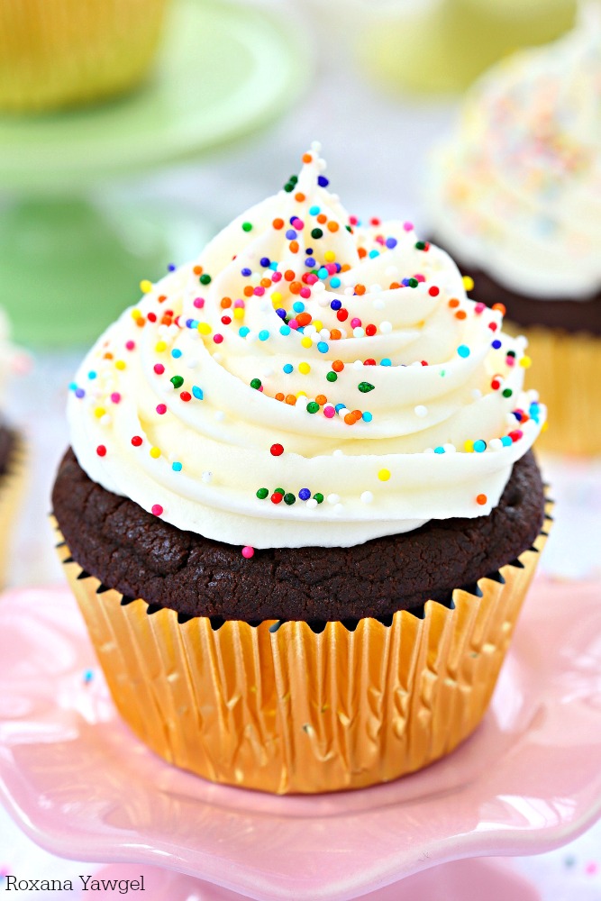 So soft, fluffy, and full of chocolate flavor in every bite, these sugar cookie chocolate cupcakes are piled high with cream cheese frosting and finished with colorful sprinkles! 