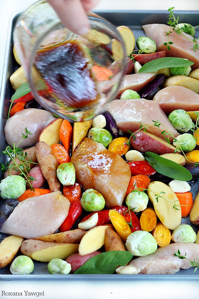 Tender chicken baked with a rainbow of vegetables - potatoes, carrots and Brussels sprouts in one single pan! Only 10 minutes of prep time to make this roasted chicken and vegetables dinner! 