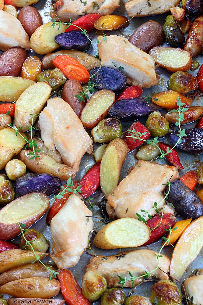 Tender chicken baked with a rainbow of vegetables - potatoes, carrots and Brussels sprouts in one single pan! Only 10 minutes of prep time to make this roasted chicken and vegetables dinner! 