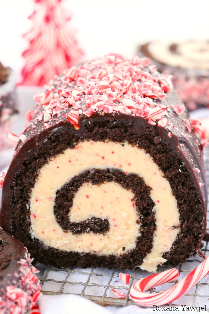 A delicious chocolate cake filled with an irresistible peppermint white chocolate filling, this chocolate peppermint bark roll cake is perfect for the Christmas holiday! Don't be intimidated by its festive swirl, follow my tips for a successful roll cake every time!