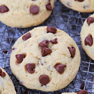 Happiness is a plate of these soft chocolate chip sugar cookies right out of the oven! Loaded with mini chocolate chips and dotted with more chocolate chips on top these cookies are a favorite treat! The dough comes together in a matter of minutes, and no chilling is required.
