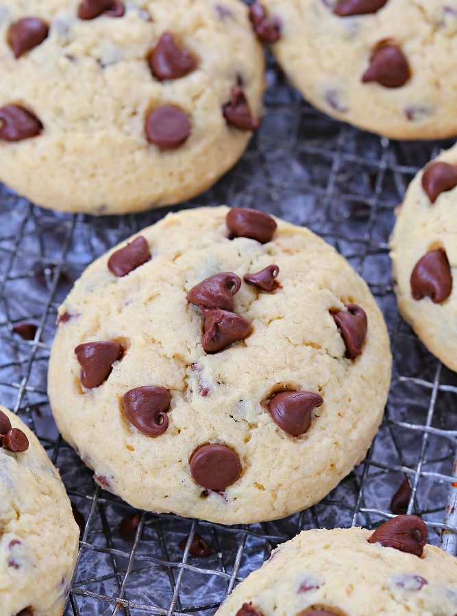 Happiness is a plate of these soft chocolate chip sugar cookies right out of the oven! Loaded with mini chocolate chips and dotted with more chocolate chips on top these cookies are a favorite treat! The dough comes together in a matter of minutes, and no chilling is required.