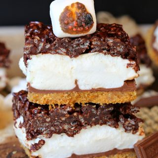 Layers of buttery graham cracker crust, oozing milk chocolate, gooey marshmallows, and chewy chocolate rice krispies, these smores bars will quickly become a summer favorite!